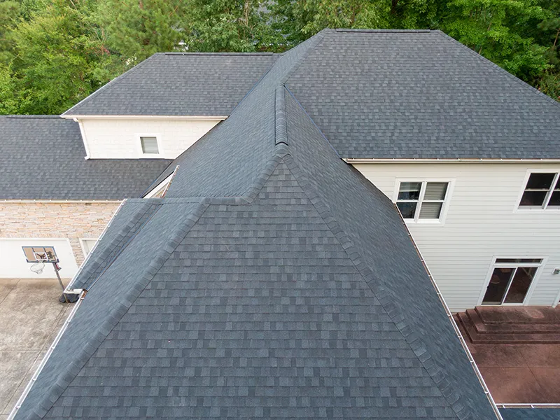 Aerial view of a West Fargo, ND home featuring a new architectural shingle residential roofing installation.